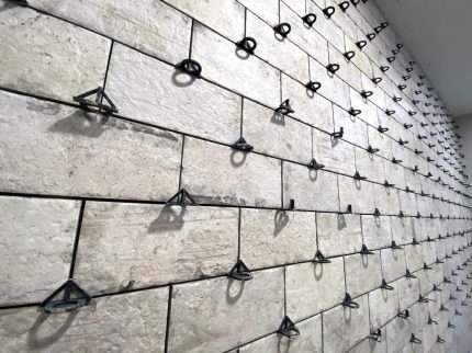 Ubertile spacers in use on a tile wall